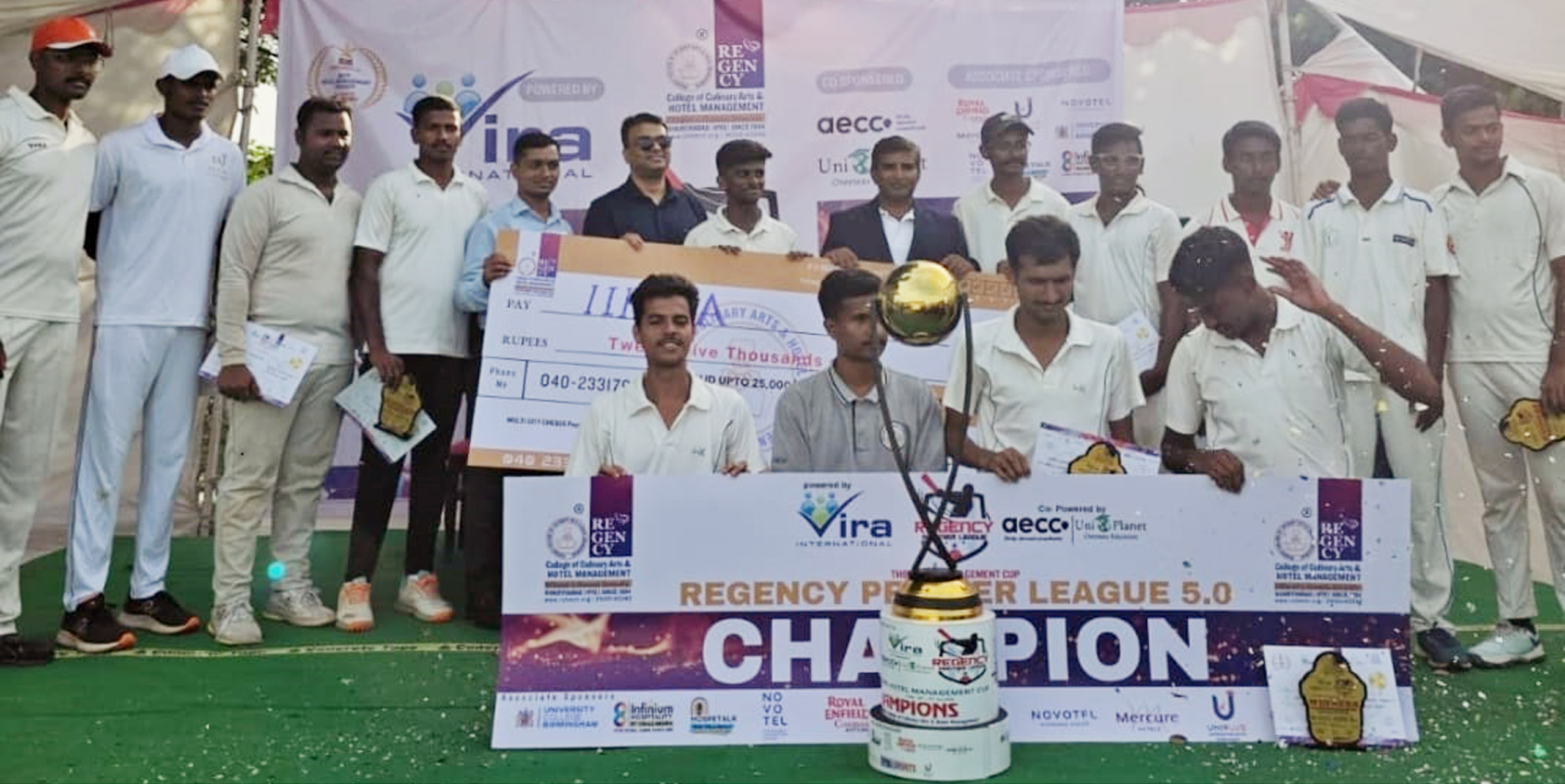 P. Ramesh Kumar Reddy (8th from left), Principal of Regency college; Mr Ravi Trivedi (6th from left), Recruitment MGR VIRA Consultancy; presenting a trophy and a cash prize to Anish, Captain, Aravind, Vice-Captain, with teammates of overall champions IIHMCA at the Regency College of Culinary Arts & Hotel Management organized most prestigious Cricket tournament RPL (Regency Premier League 5.0) at BSR grounds, Bandlaguda, Nagole, Hyderabad, today.